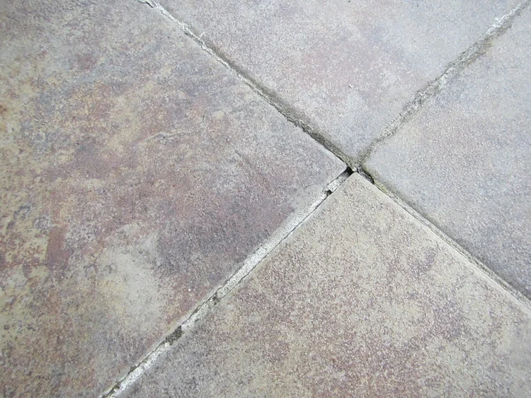 Cracked tile grout and flooring defects in new apartment - GharCheck