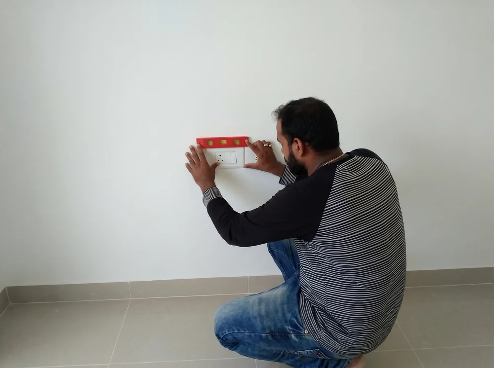 Misaligned electrical switchboard and safety hazards in residential property - GharCheck